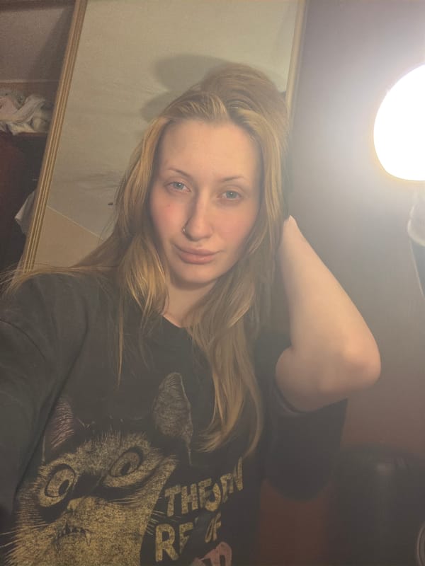Back-to-back selfies in a dim room, Vaganovo