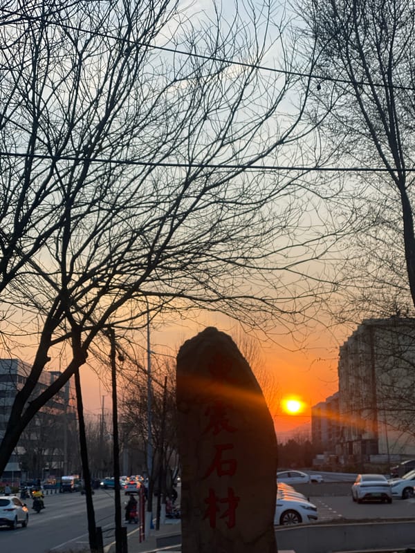 Sunset captured over urban street scene in Zhongtun, China