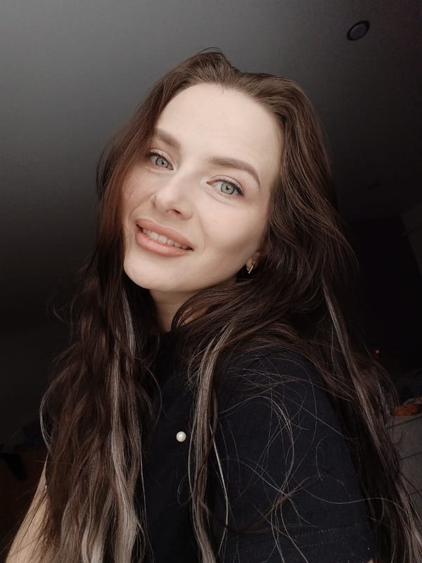 Woman photographed smiling indoors in Rusalevka, Russia