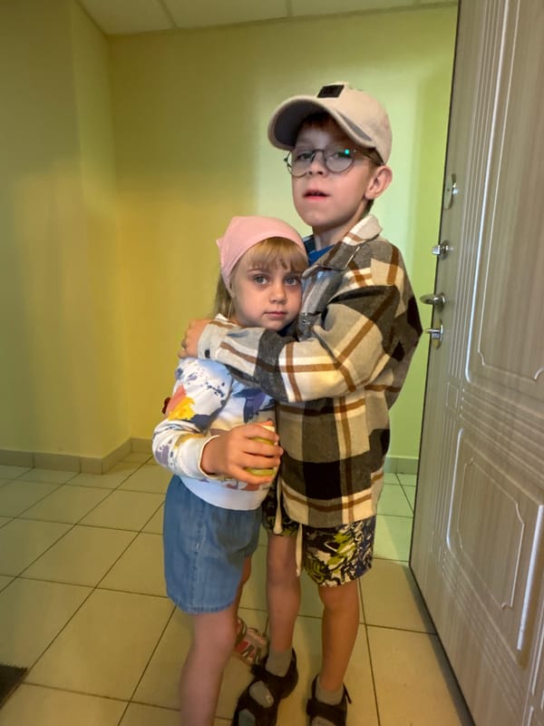 Kids in a hallway, sunny street scene, Russia