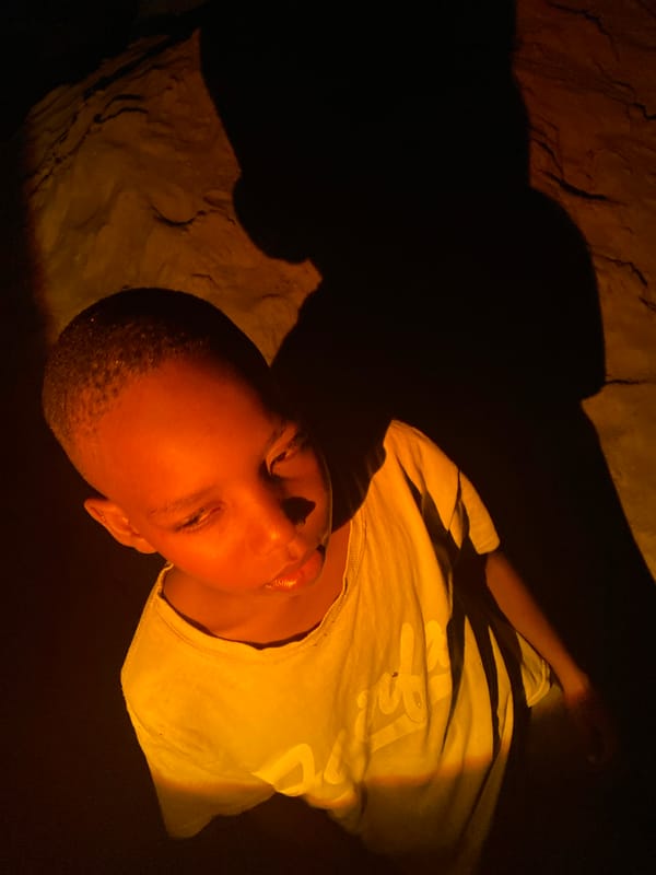 Evening portraits and soccer captured in Nigeria neighborhoods