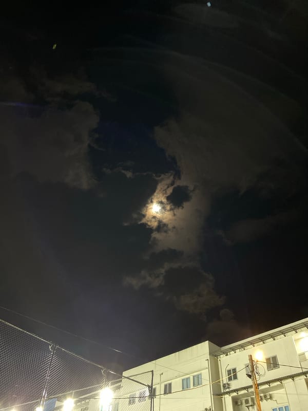 Banda Aceh neighborhood at night: courts, food spots, and new construction