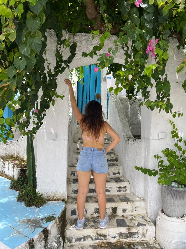 Photo session at a blue-doored whitewashed spot in Phu Thuy Ward