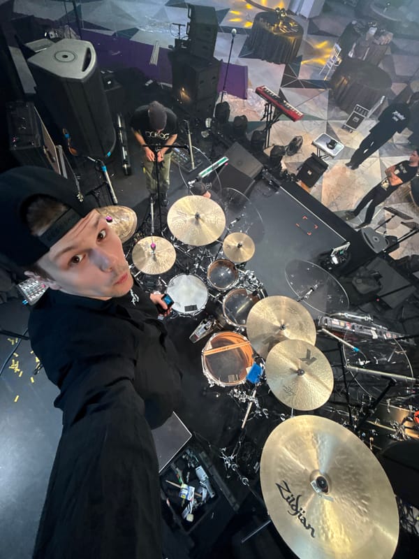 Drummer performs on Moscow stage, looks at cameras
