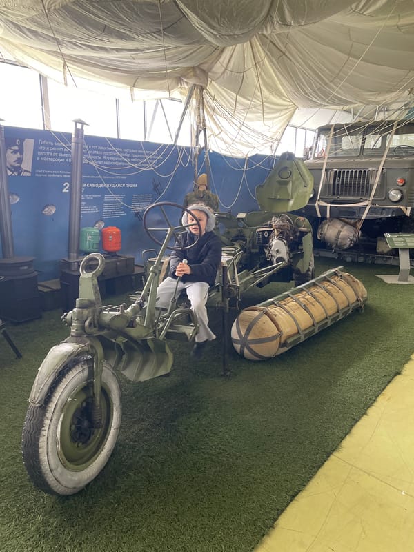 Museum visitor documents military and tech exhibits in Tolyatti