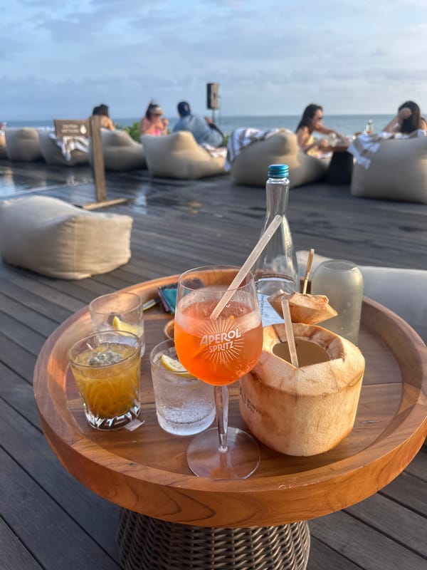 Drinks on a deck tray, waterfront setting