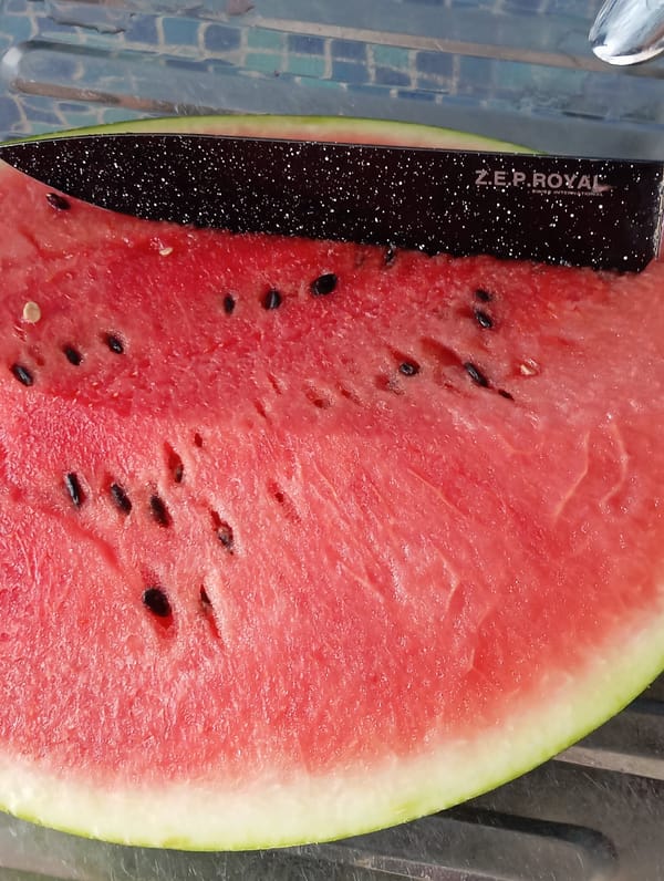 Fresh watermelon being sliced and served in Temryuk