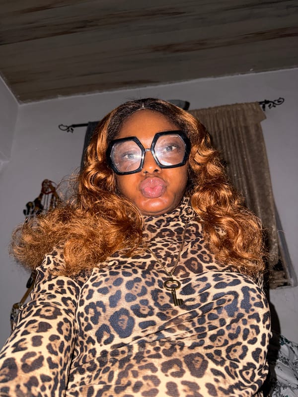 Leopard-print and statement glasses in an Ado, Nigeria interior