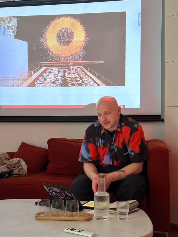 Man views abstract art on projection screen in Moscow