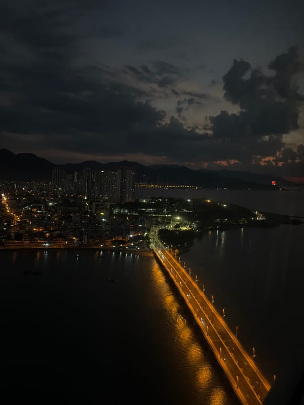Illuminated bridge captured at night in Nha Trang Bay