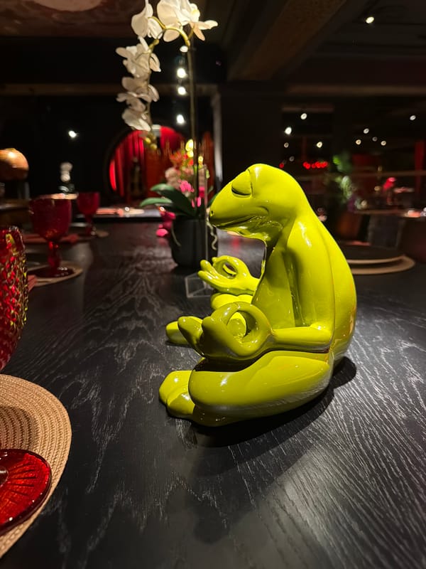 Moscow bar interior captured with decorative sculptures, patrons
