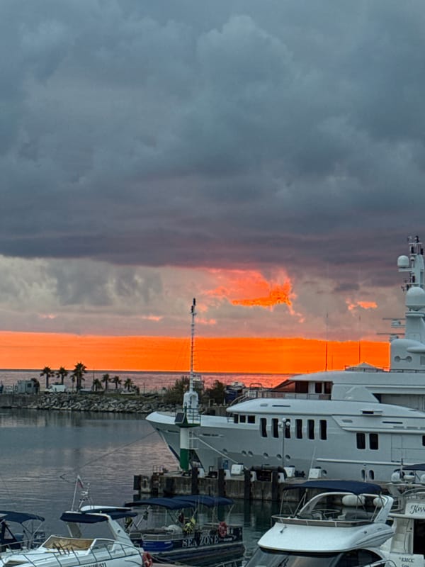 Sochi harbor sunset and city scenes, late June afternoon