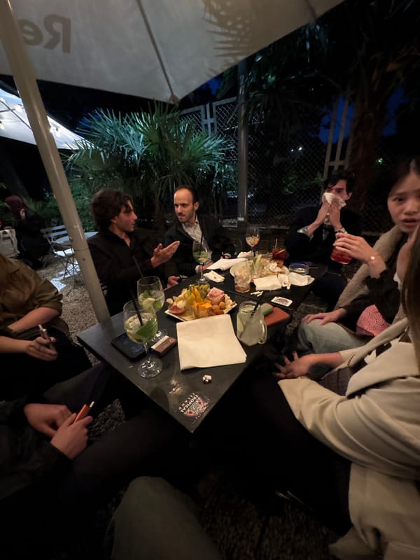 Evening social gathering at outdoor Milan restaurant