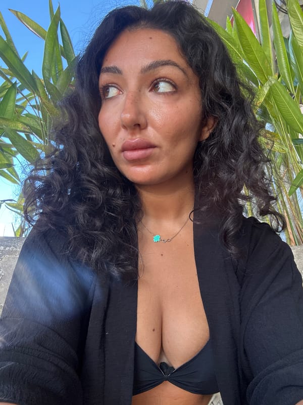 Woman photographed multiple times in tropical Kuta Selatan setting