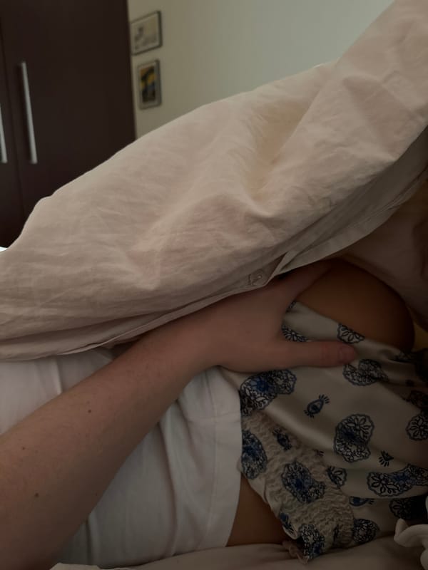 Person documented in bed with phone during afternoon rest