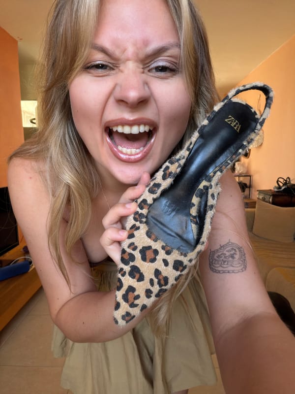 Woman tries on leopard-print shoes in Tel Aviv apartment