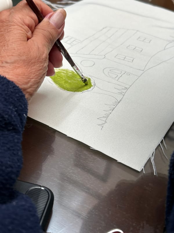 Artist creates landscape and floral paintings in outdoor session