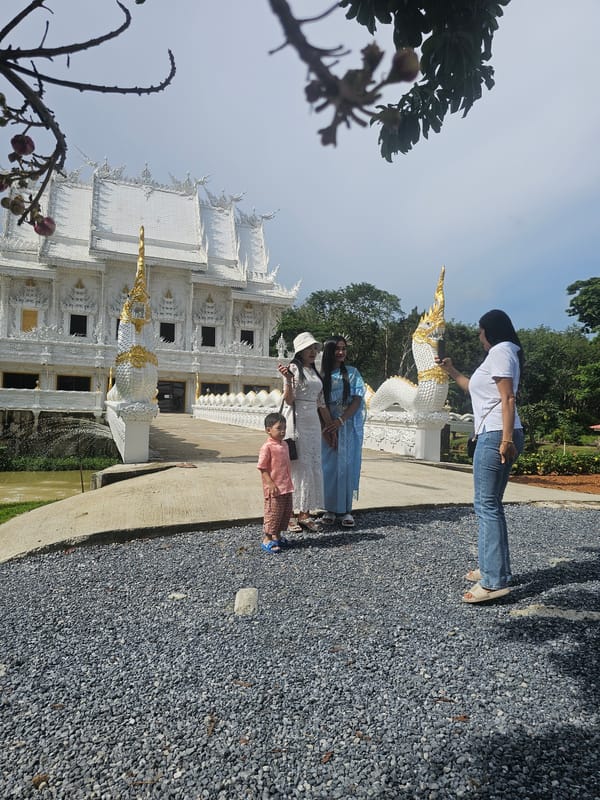 Group visit to Wat Rong Khun during a ceremonial occasion
