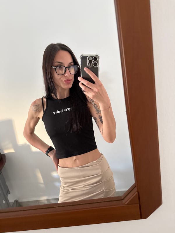 Woman with sun moon tattoos photographed in Chania Greece