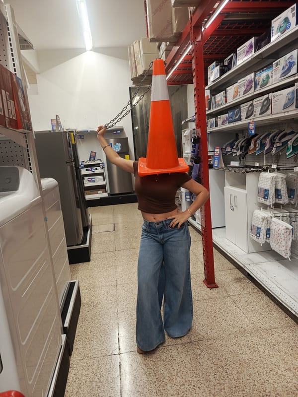 Person wears traffic cone in Guayaquil store aisle