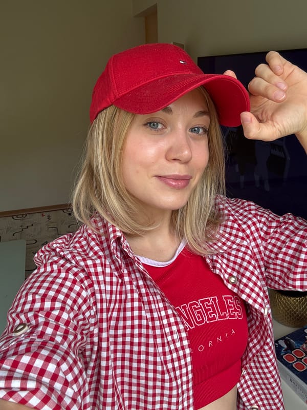 Woman takes selfies in red California outfit in Riga