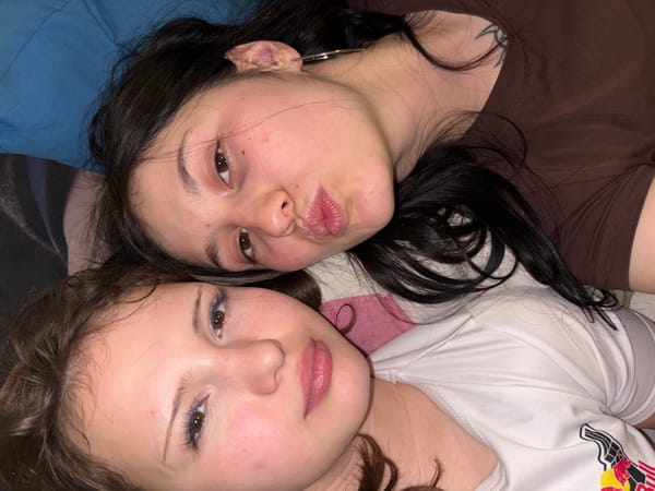 Two women photographed with eyes closed in Foki, Russia