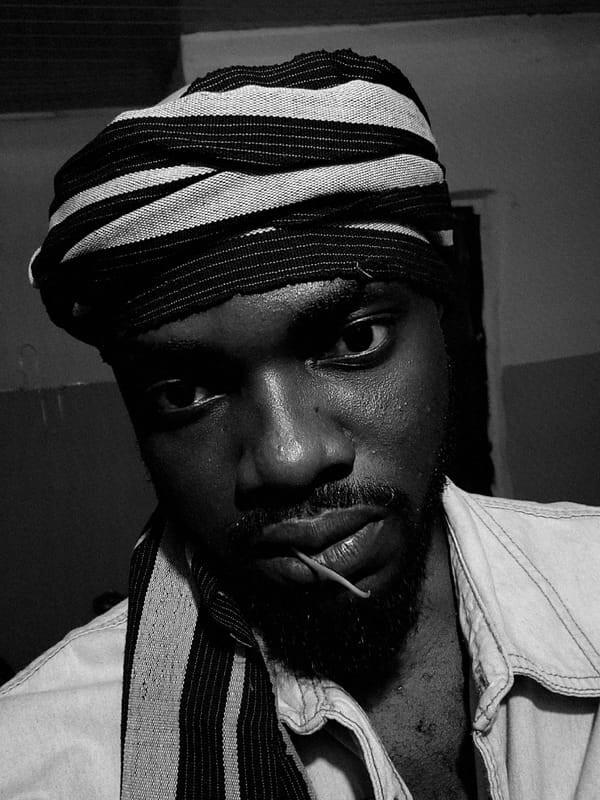 Man in striped headwrap photographed in Jos, Nigeria