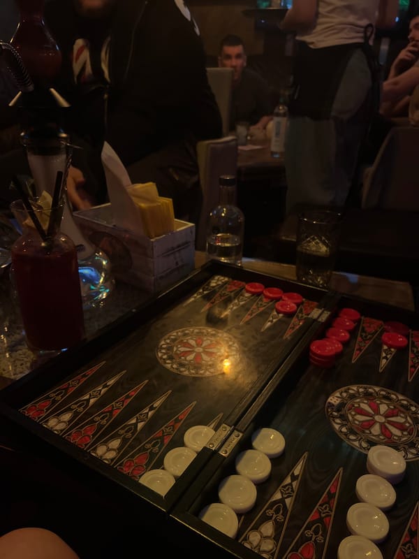 Backgammon game in progress at social gathering in Pleven