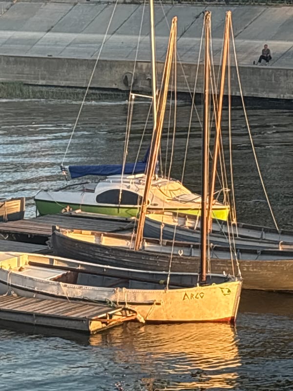 Golden hour on the Volga: boats, anglers, and Astrakhan's riverfront