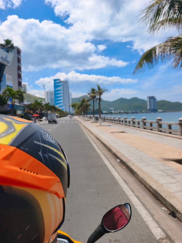 Motorbike POV along Nha Trang's sunny coastal road