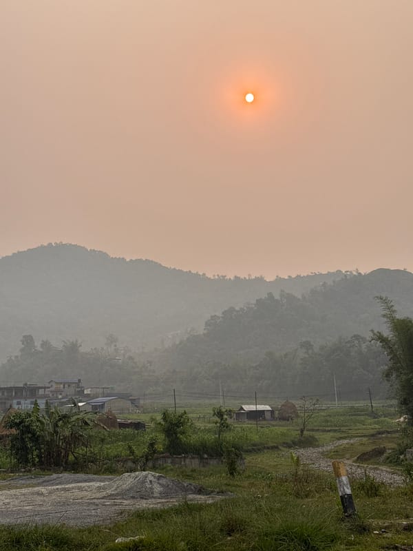 Hazy mountain landscape documented near Pokhara, Nepal