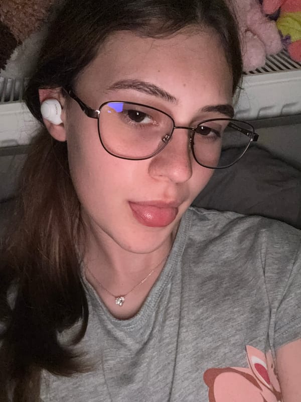 Woman takes playful selfies with Patrick Star plush toy