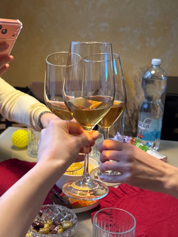 Indoor champagne toast celebration with appetizers and city views