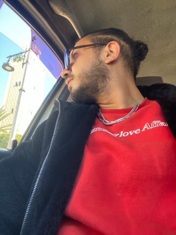 Man observed in vehicle looking out window in Meknes