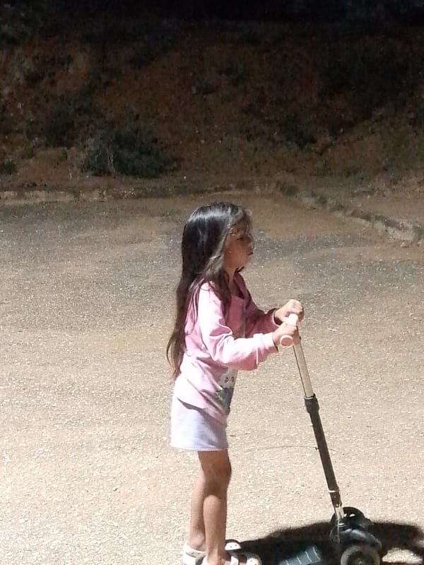 Mother and daughter share playful moments in Venezuelan coastal town