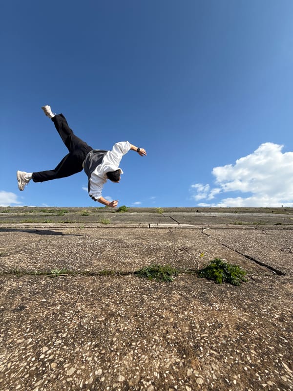 Person performs acrobatics on bridge structure in Shumen