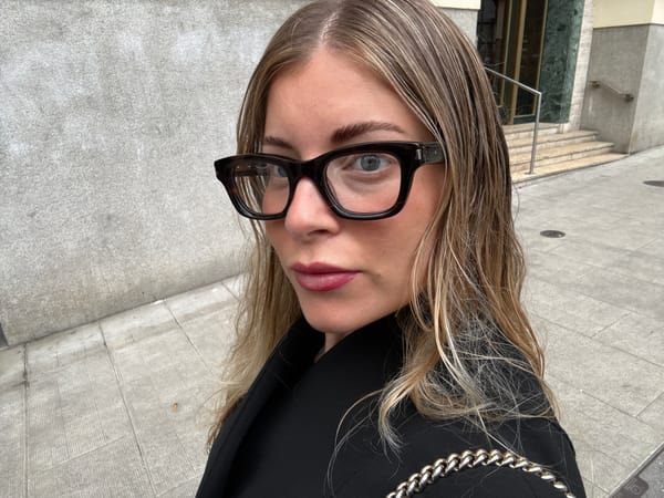 Women photographed in urban Geneva street scenes