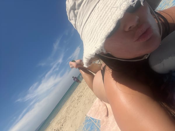 Beach relaxation captured in Acre under sunny skies