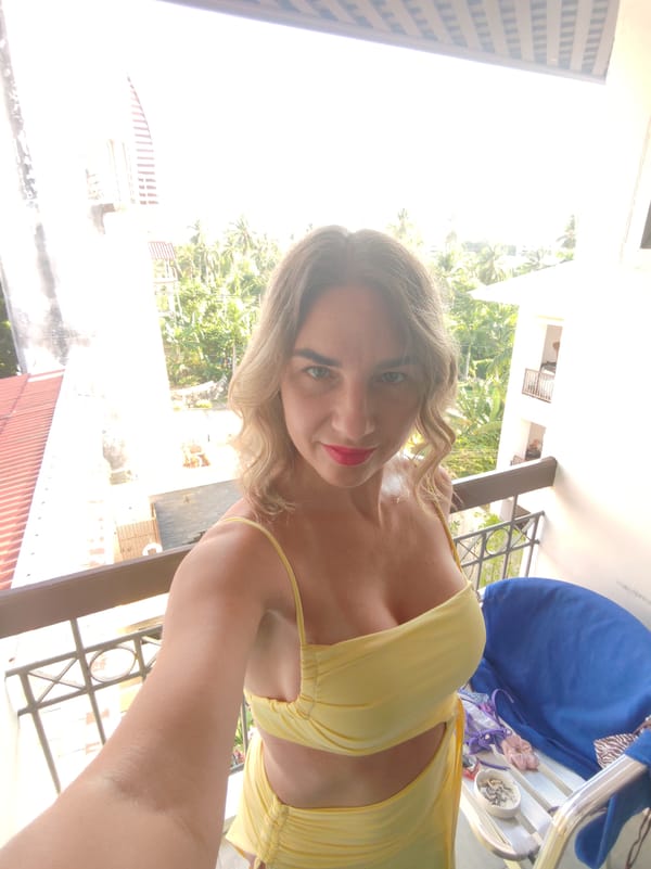 Tourist takes selfie from resort balcony in Karon, Thailand
