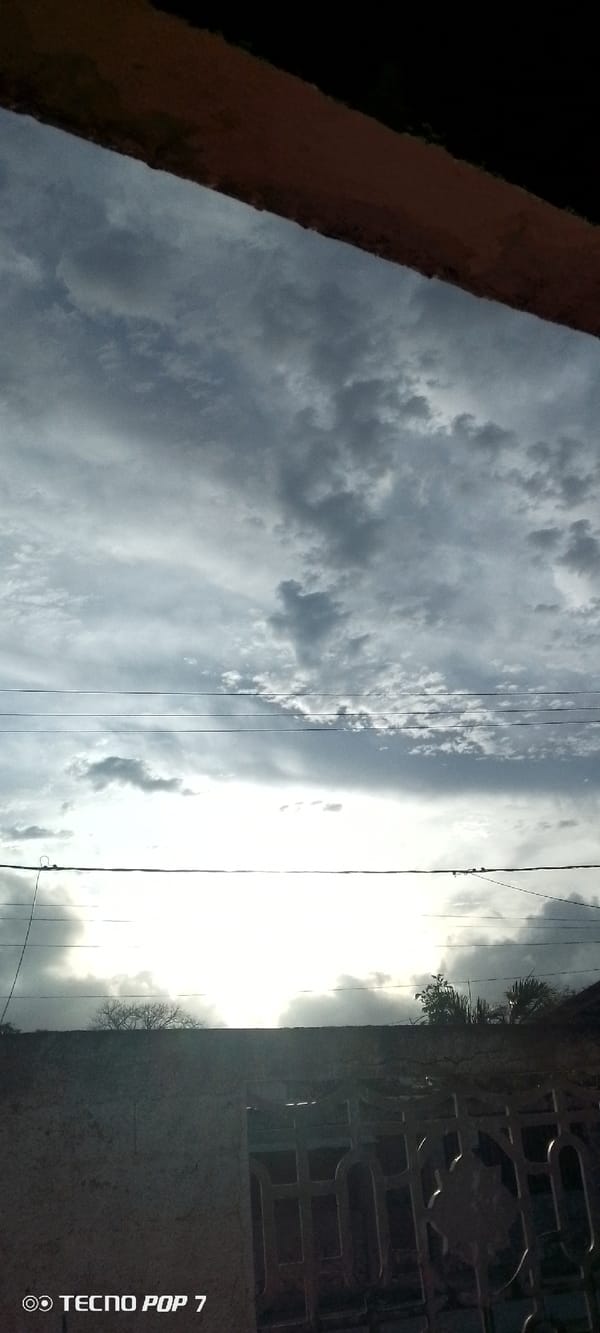 Resident documents cloudy skies over Altagracia, Venezuela neighborhood