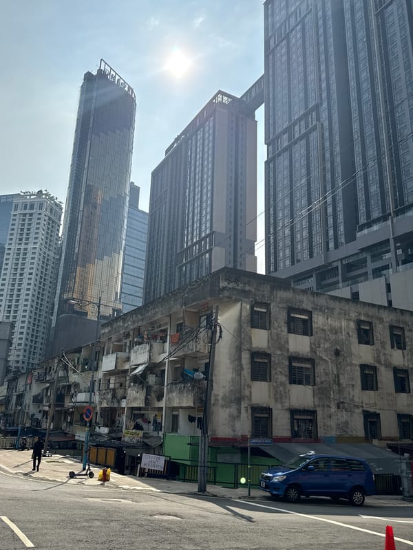 Kuala Lumpur street scenes show modern towers amid older buildings