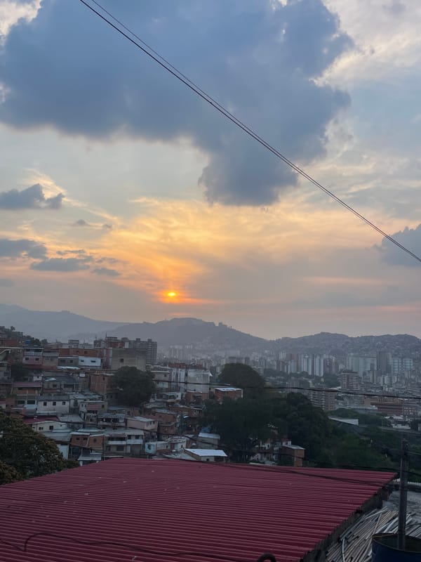 Sunset cityscape captured in dense Caracas neighborhood