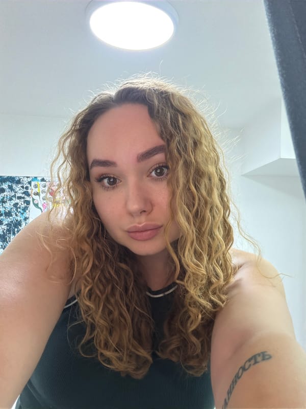Woman enjoys quiet afternoon gaming and selfies at home