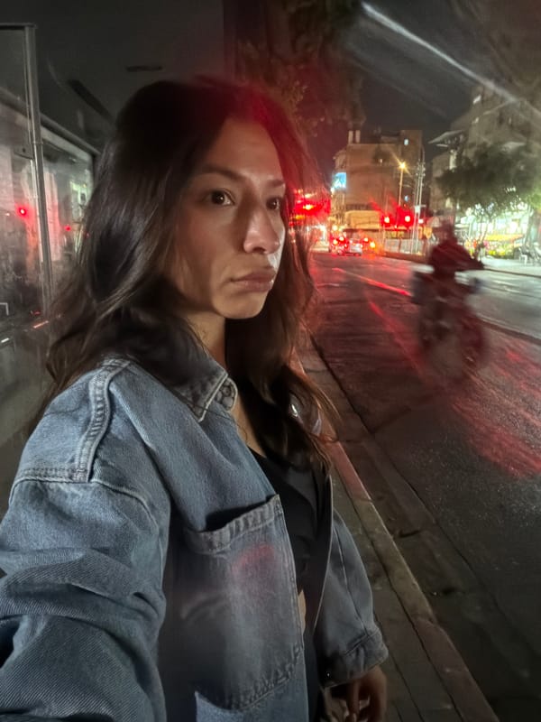 Woman photographed on Tel Aviv street with traffic backdrop