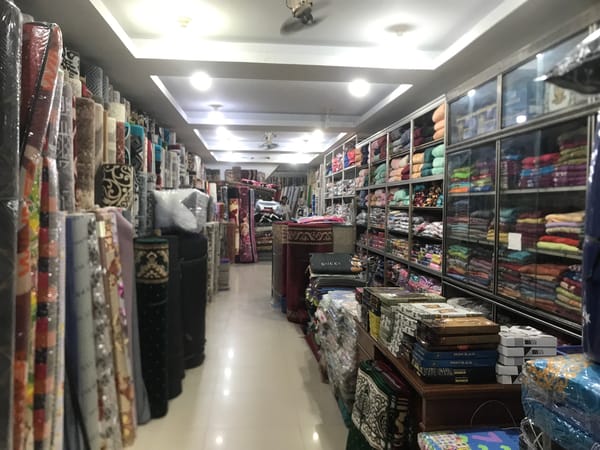 Textile shop displays carpets and fabrics in Banda Aceh