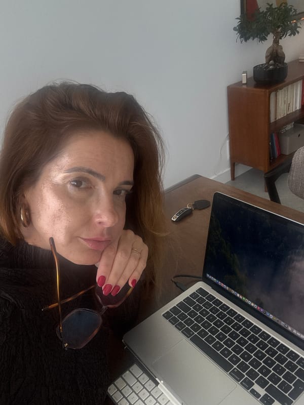 Woman at wooden desk in Torres Vedras indoor setting
