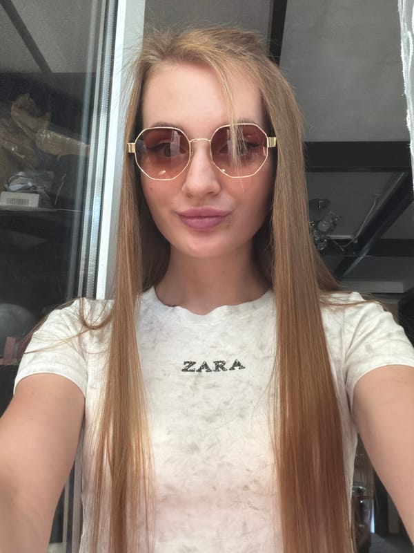 Indoor selfie in a white ZARA tee and statement glasses