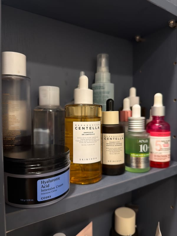 Skincare product collection documented in Laval bathroom storage