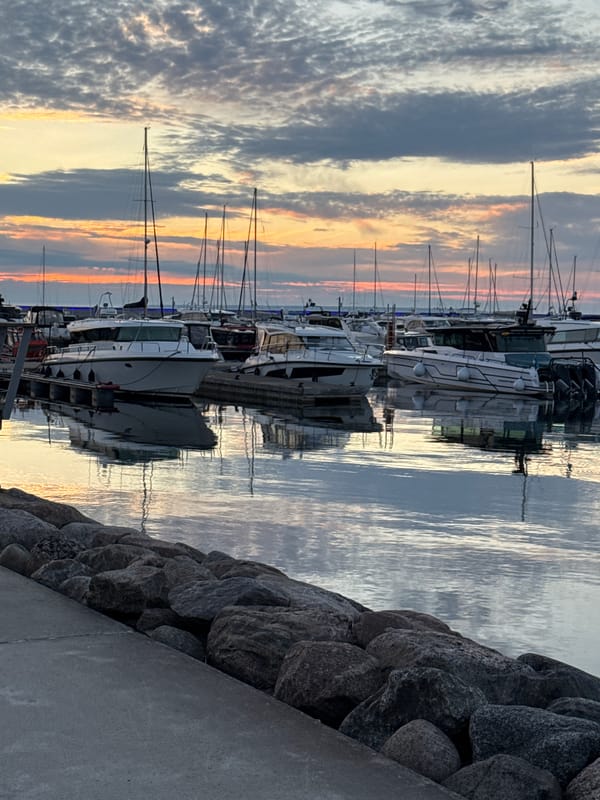 Tallinn marina at sunset, boats docked and sky ablaze