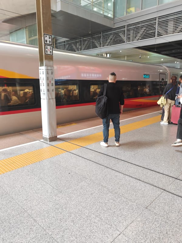 Morning commuters gather at Nanjing South Railway Station platform